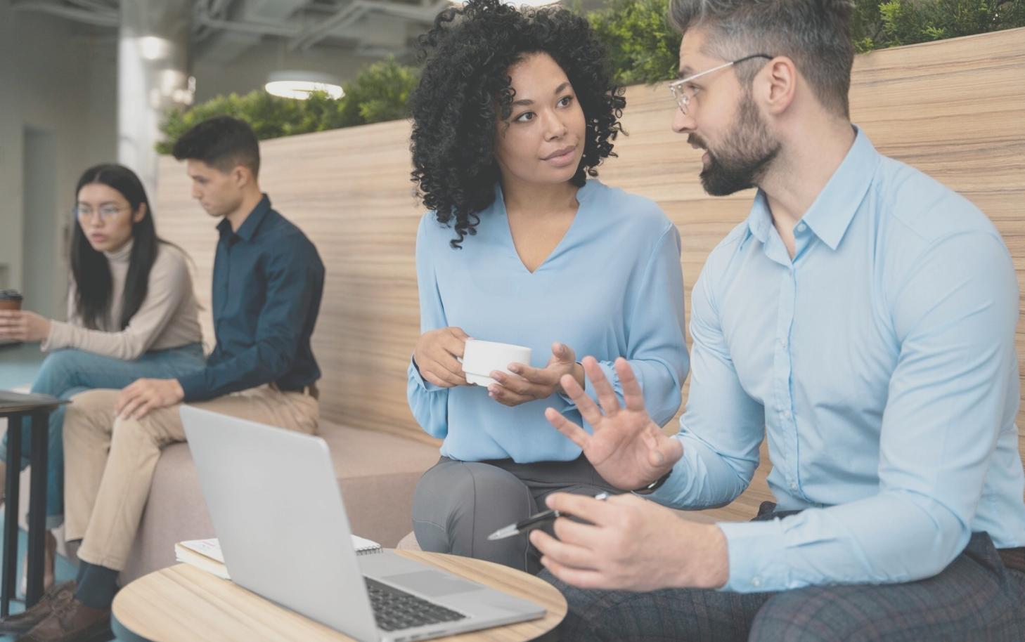 Professional financial advisor reviewing budget analysis charts and presenting to clients