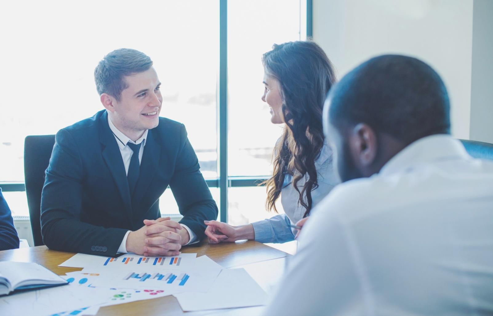 Professional reviewing annual budget documents and financial planning materials